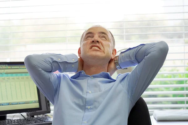 Tired Neck. Office worker man suffering From Neck Pain. male Feeling Tired, Exhausted, Stressed. Men Massaging Painful Neck With Hands. Body And Health Care Concept.