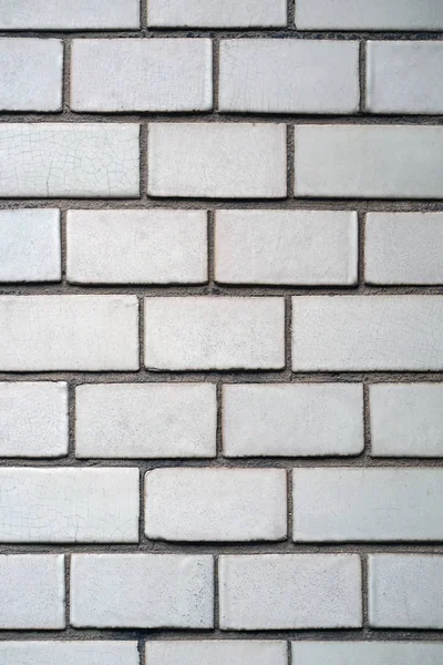 White brick wall texture background. Square white brick wall background. Old white brick wall background texture close-up.