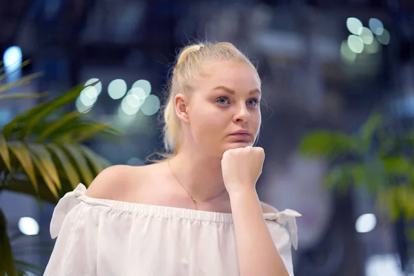 Lonely young girl is sad. Portrait of a beautiful sad girl close-up. Woman feel depression.