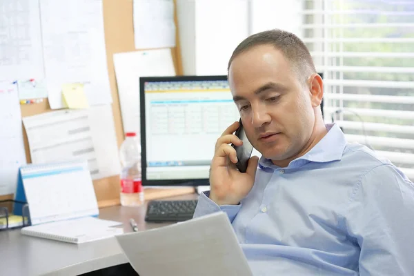 Happy entrepreneur man reading good news in a letter