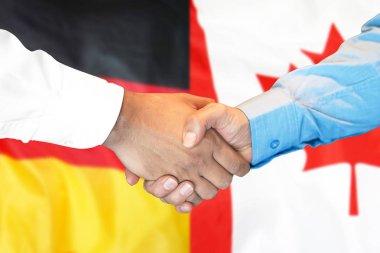 Almanya ve Kanada bayrak arka plan üzerinde el sıkışma.