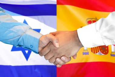 İspanya ve İsrail bayrağı arka planda el sıkışma.