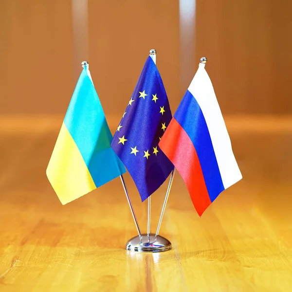 Flags of Russia, European Union and Ukraine.
