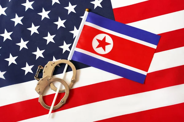 Flag of USA and North Korea. Handcuffs. Sanctions. — Stock Photo, Image