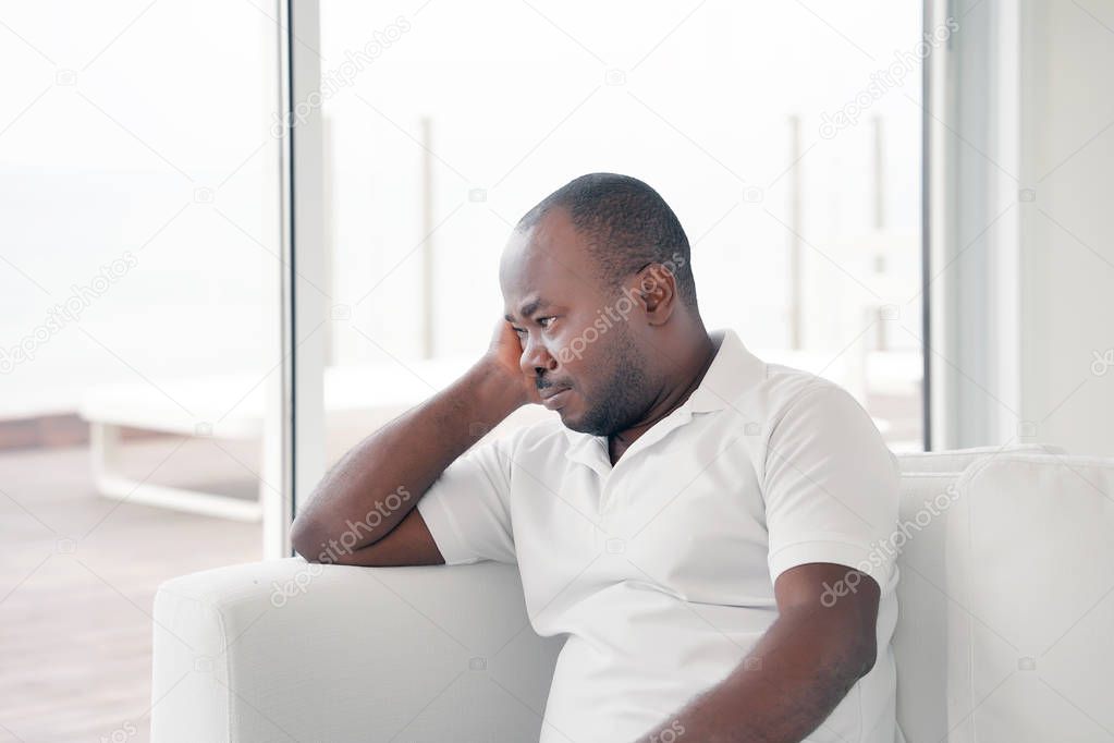 elderly african man in grief