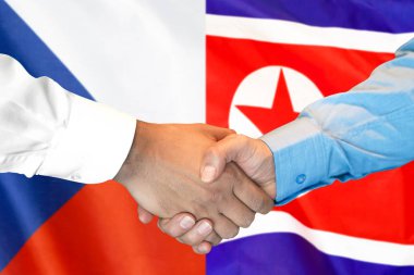 el sıkışması Çek Cumhuriyeti ve Kuzey Kore bayrağı arka plan.