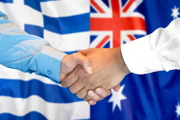 Handshake na Grecji i Australii flaga tle. — Zdjęcie stockowe