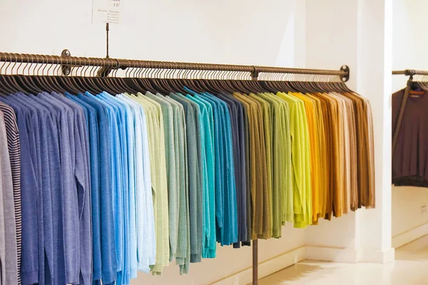 colorful T-shirts on hangers