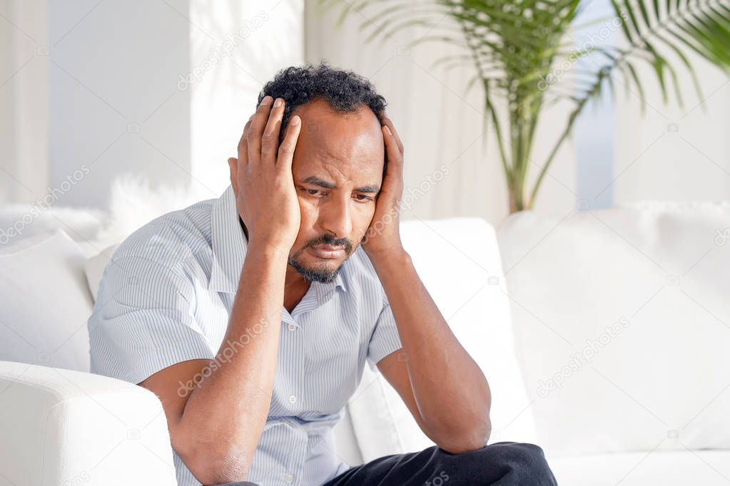 african man in grief