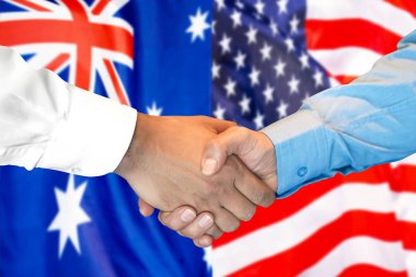 Avustralya ve Abd bayrağı arka planda el sıkışma.