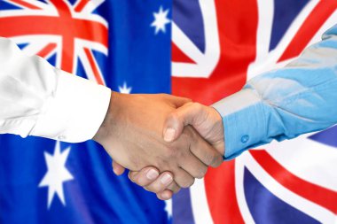 Avustralya ve İngiltere bayrak arka plan üzerinde el sıkışma.