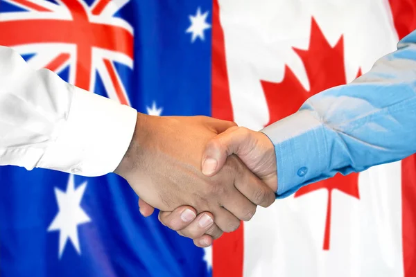 握手澳大利亚和加拿大国旗背景. — 图库照片
