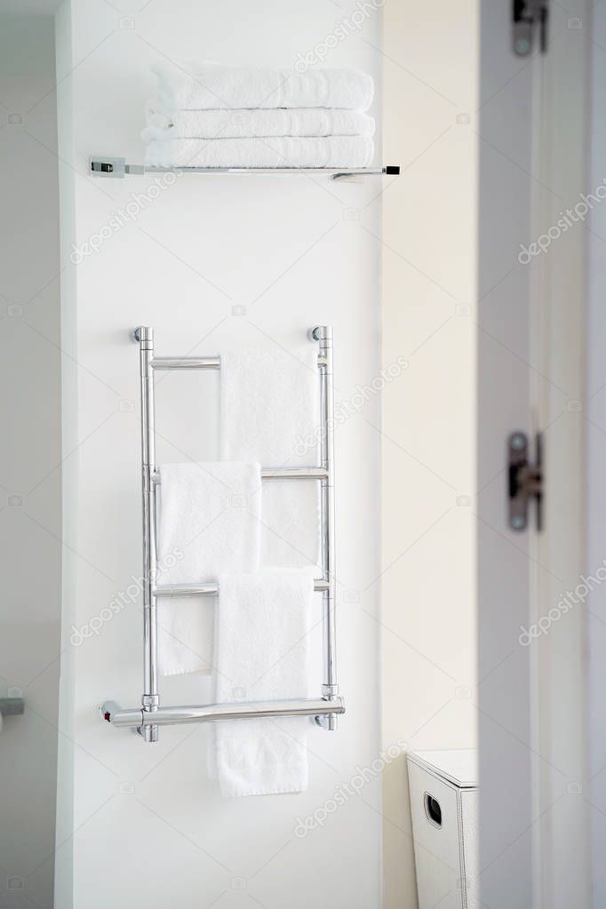 Chrome towel rail in the bathroom