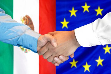 Meksika ve Avrupa Birliği bayrak arka plan üzerinde el sıkışma.