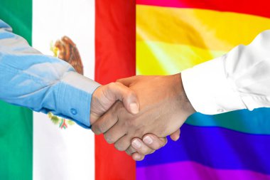 Meksika ve Lgbt gay bayrağı arka plan üzerinde el sıkışma.