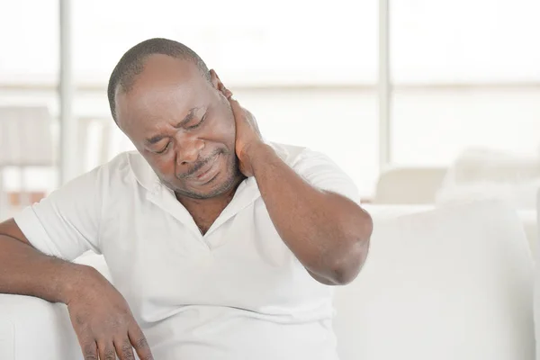 Pain in the neck of a man from fatigue. Tired neck. — Stock Photo, Image