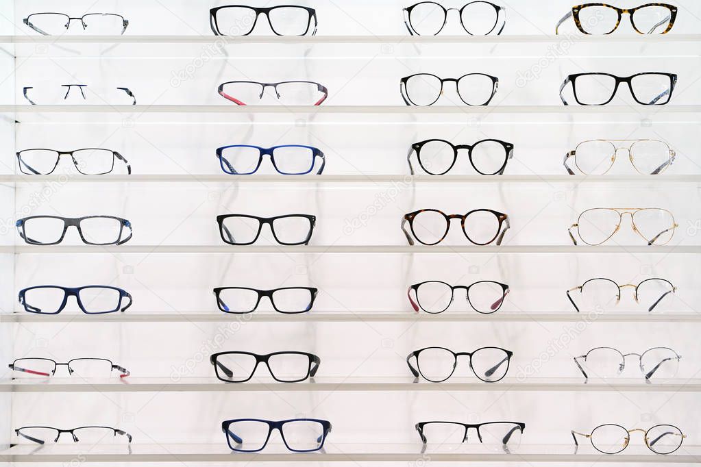 Stand with glasses in the store of optics.