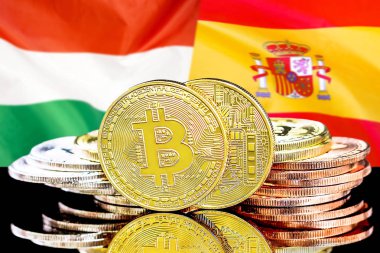 Macaristan ve İspanya bayrak arka plan üzerinde bitcoins