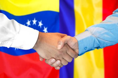 Venezuela ve Moldova bayrak arka plan üzerinde el sıkışma.