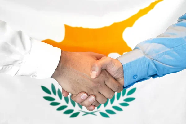 Handshake on Cyprus flag background.