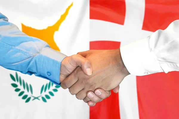 Handshake on Cyprus and Denmark flag background. — Stock Photo, Image