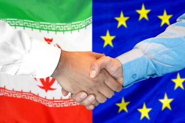 İran ve Avrupa Birliği bayrak arka plan üzerinde el sıkışma.