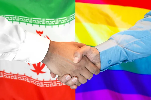 Stretta di mano su Iran e LGBT gay bandiera sfondo . — Foto Stock