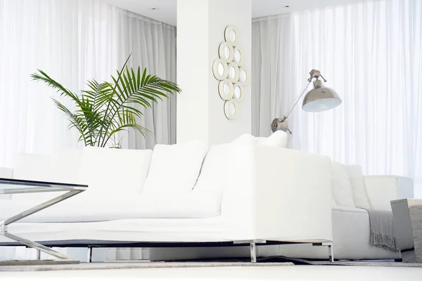White room with sofa.