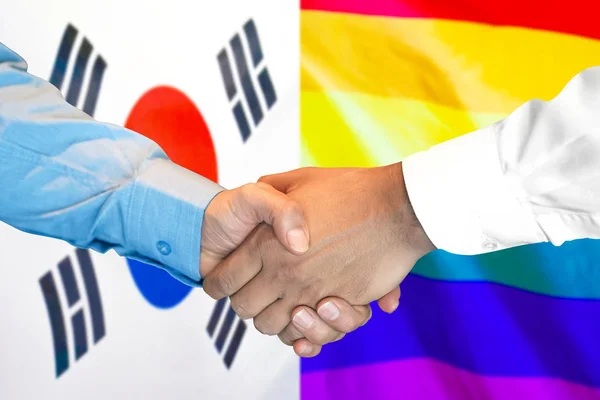 Stretta di mano su Corea del Sud e LGBT gay bandiera sfondo . — Foto Stock