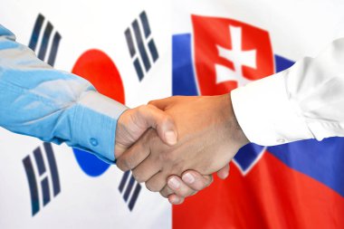 Güney Kore ve Slovakya bayrak arka plan üzerinde El sıkışma.