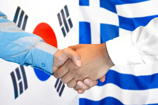 Handshake na Korei Południowej i Grecji tle flagi. — Zdjęcie stockowe