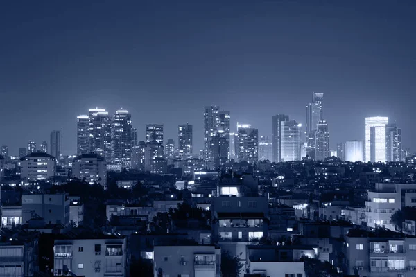 Cityscape, modern building on a night blue background.
