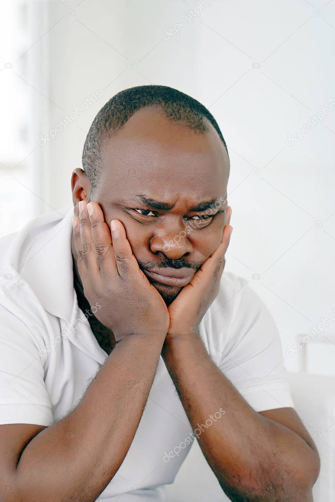 african elderly man in grief