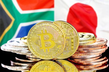 Güney Afrika ve Japonya bayrak arkaplanındaki Bitcoinler