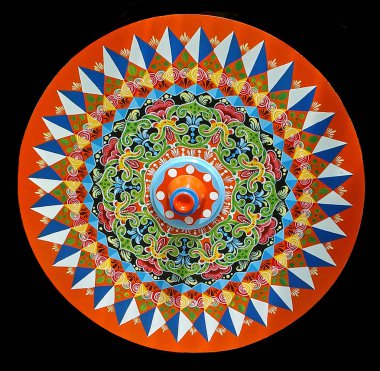 Cutout of a typical South American restored ox wheel from a historic ox wagon, very colorfully decorated and painted, from Costa Rica, against a black background clipart