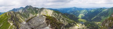 Panoramic view from Placlive peak on Western Tatra mountains or Rohace panorama. Sharp green mountains and lake rohacske pleso, ostry rohac, hruba kopa and volovec with hiking trail on ridge. Summer clipart