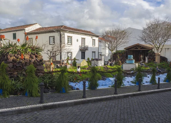 PORTUGAL, VILA FRANCA DO CAMPO, Sao Miguel, Azores,December 28, 2018: Big old realistic Nativity scene with christmas crib creche, miniatures of city main buildings and figures of daily live scenes in — Stock Photo, Image