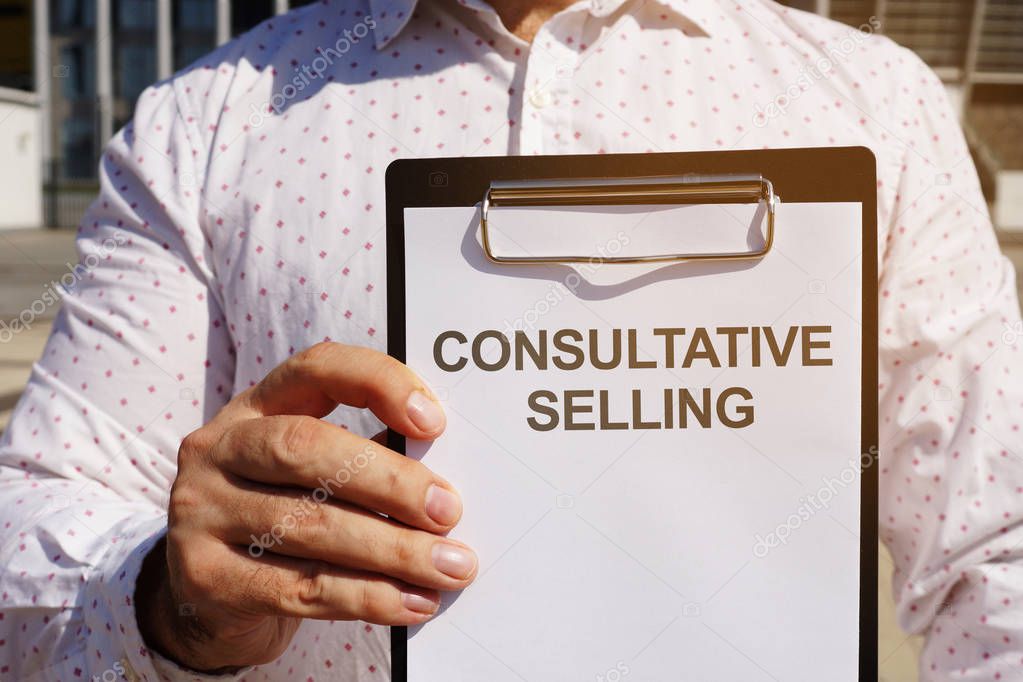 Text sign showing hand writing words Consultative Selling