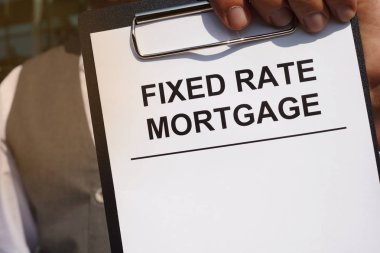 Writing note shows the printed text Fixed rate mortgage clipart