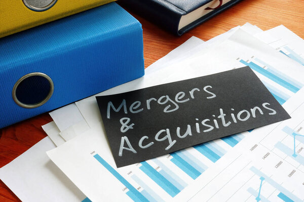 Mergers And Acquisitions is shown on the conceptual business photo