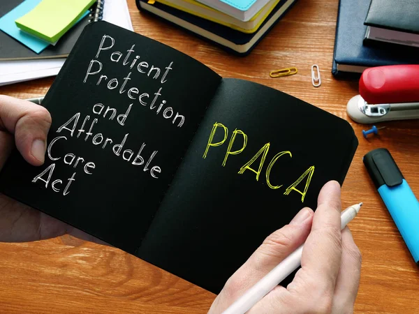 Patiëntenbescherming en betaalbare zorg Act PPACA wordt weergegeven op de zakelijke foto — Stockfoto