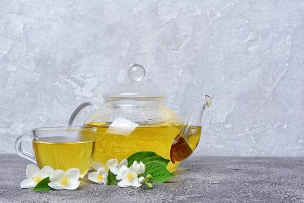 Close Glass Teapot Teacup Green Tea Jasmine Flowers Gray Concrete — Stock Photo, Image