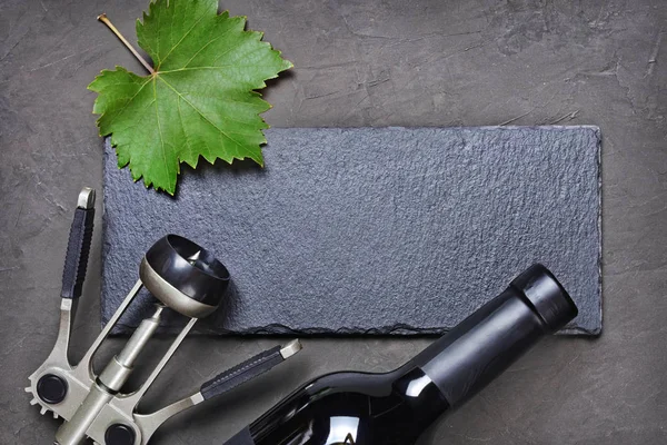 Flat Lay Lying Wine Bottle Metal Corkscrew Black Slate Board — Stock Photo, Image