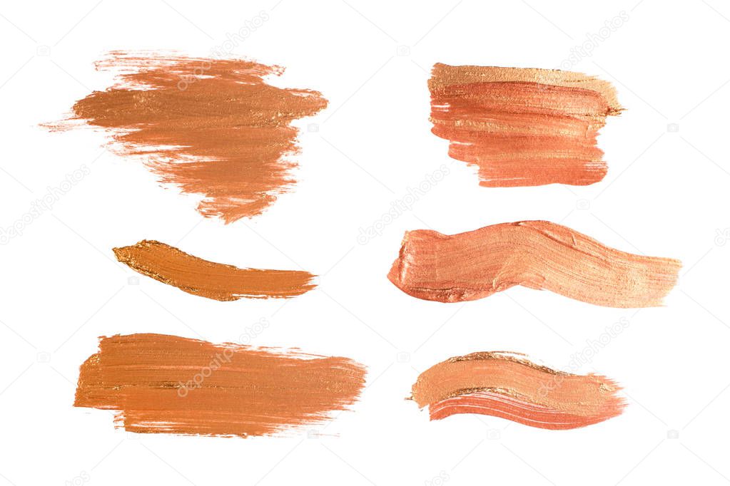 Set of shiny beige brush strokes of acrilic or oil paint as sample of art product isolated on white background