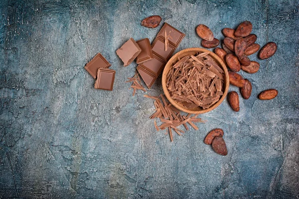 Top View Chocolate Chips Pieces Bars Cocoa Beans Confectionery Blue — Stock Photo, Image