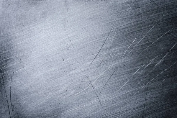 关闭灰色的磨碎金属纹理背景与划痕的设计 — 图库照片