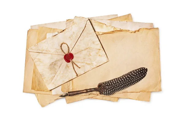 Vintage composition with yellowed paper sheets and quill pen — Stock Photo, Image