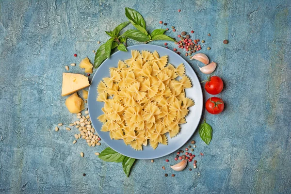 Top View Uncooked Farfalle Pasta Ingredients Pesto Sauce Parmesan Cheese — Stock Photo, Image