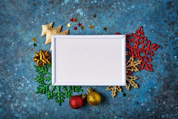 Mockup of photo frame and colored christmas decorations — ストック写真