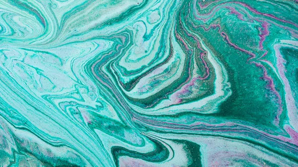 Closeup of mixed turquoise and purple abstract marble texture. Hand painted beautiful pattern, wallpaper or background for print design as invitation or greeting cards. Ocean or sea artwork